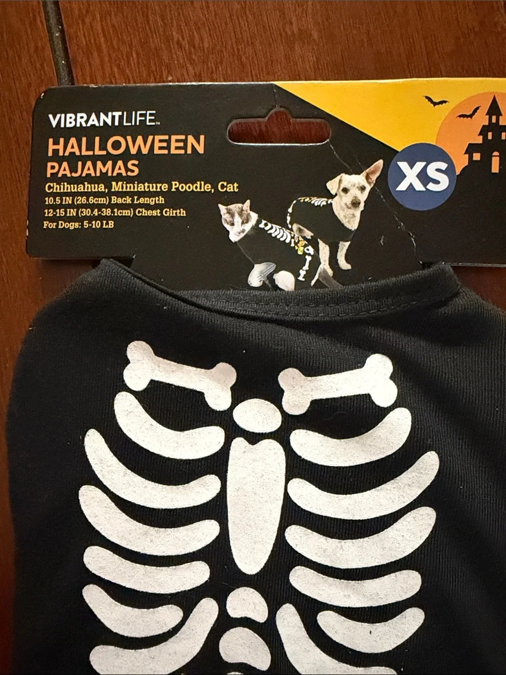 Vibrant Black Skeleton Dog Halloween Pajamas with Orange Candy Accents